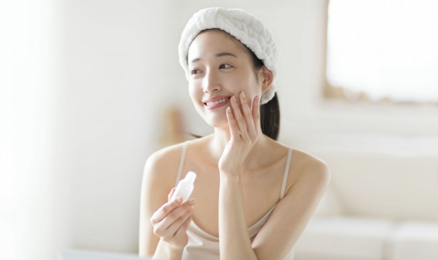 Healthy lifestyle elements including water, nutritious food, and skincare